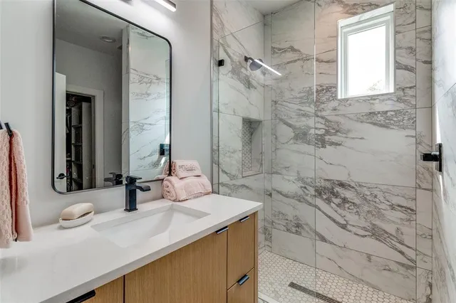 a bathroom with a sink and a mirror