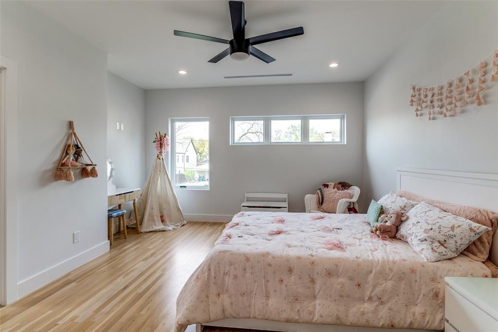 6215 Llano Avenue Dallas, TX 75214 - Photo 19 of 38 a bedroom with a bed and a window