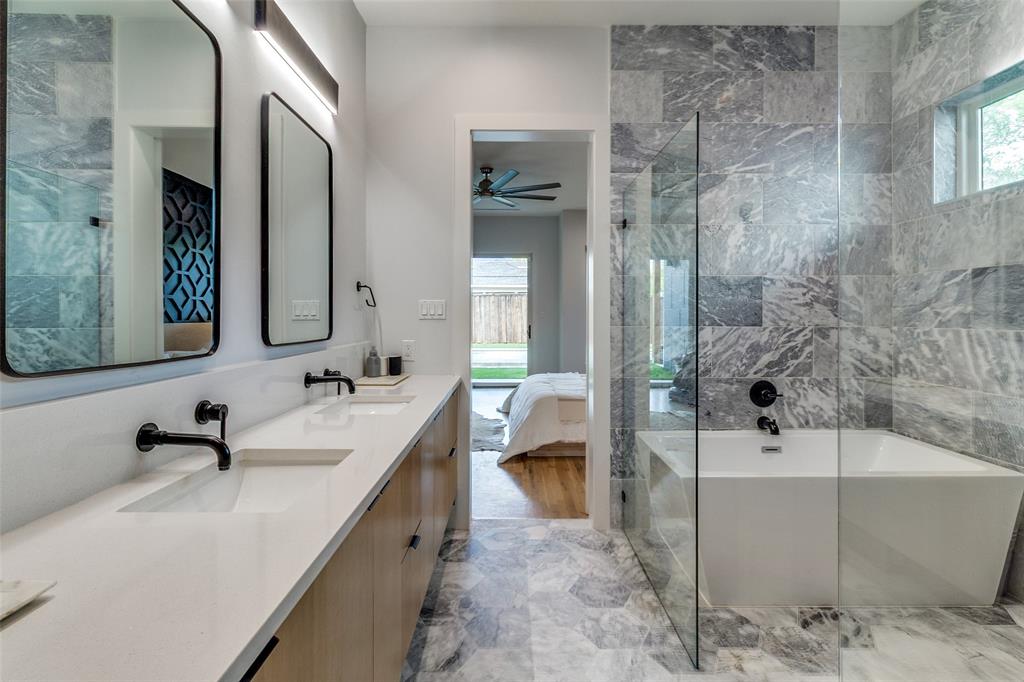 6215 Llano Avenue Dallas, TX 75214 - Photo 23 of 38 a bathroom with a double vanity sink a toilet and shower