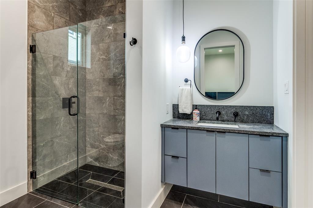 6215 Llano Avenue Dallas, TX 75214 - Photo 29 of 38 a bathroom with a sink mirror and shower