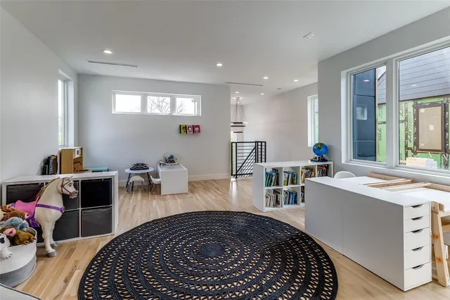 a room with furniture a rug and gym equipment