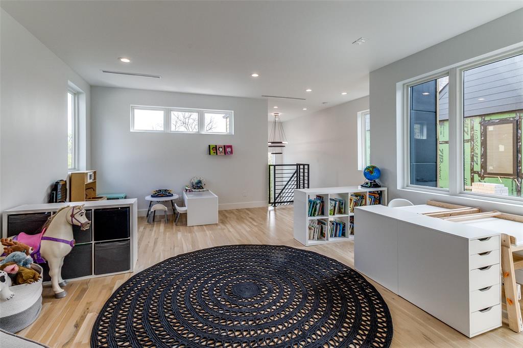 6215 Llano Avenue Dallas, TX 75214 - Photo 31 of 38 a room with furniture a rug and gym equipment