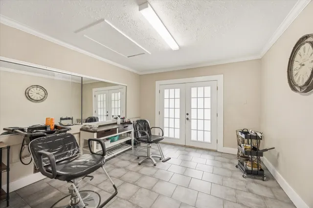 a living room with patio furniture and a window