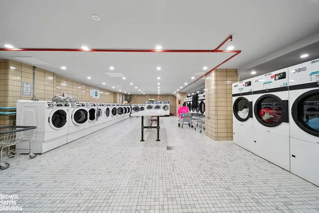 a view of kitchen appliances and a washer dryer