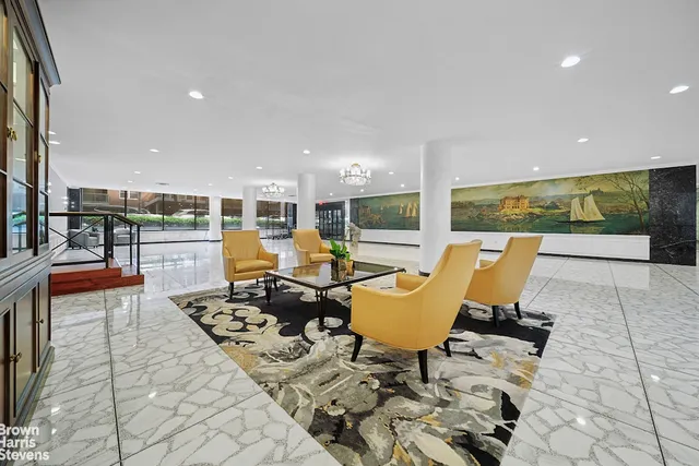 a roof deck with table and chairs