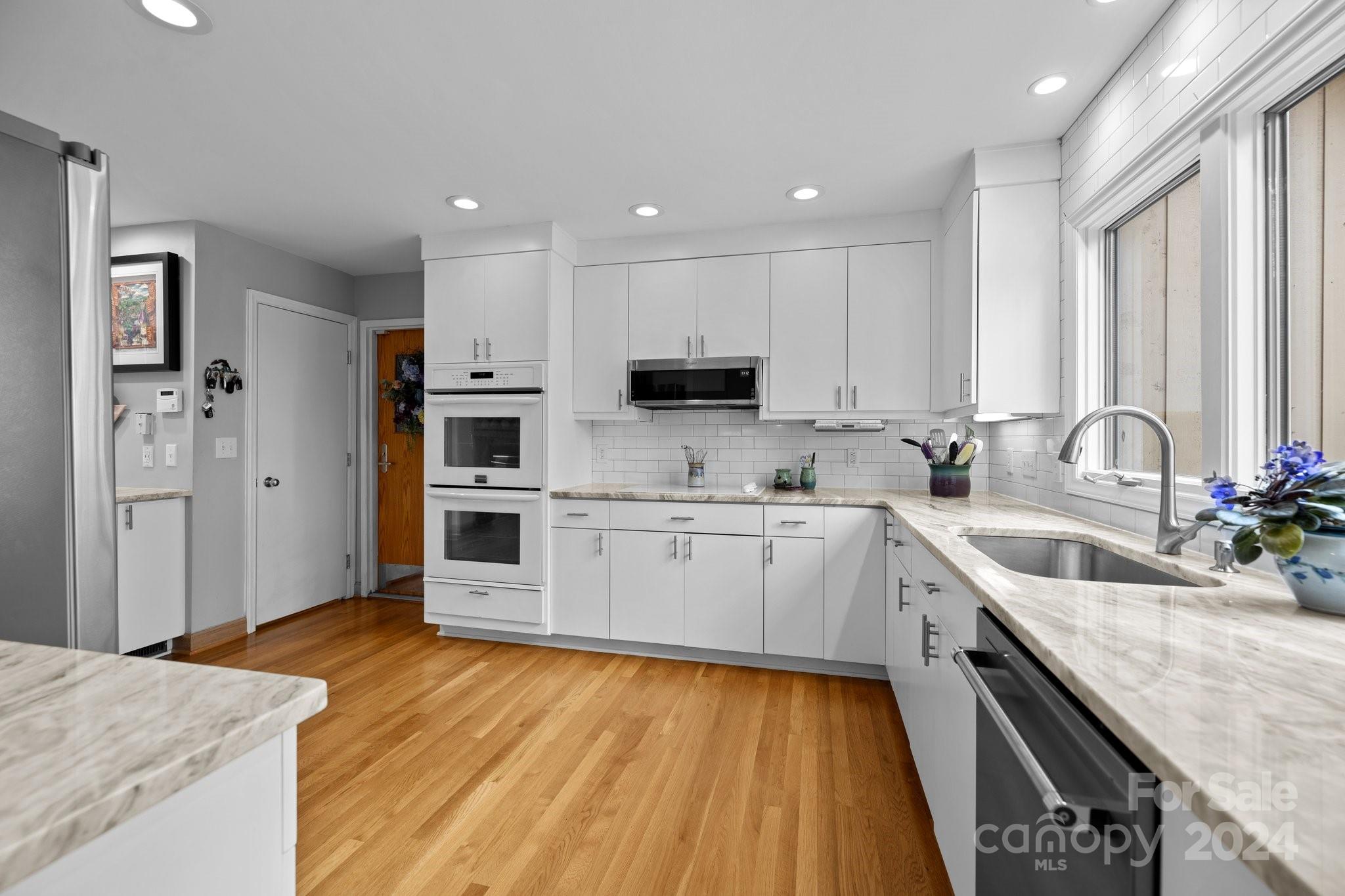 4500 Rounding Run Road Charlotte, NC 28277 - Photo 15 of 41 a kitchen with stainless steel appliances granite countertop a sink stove and refrigerator