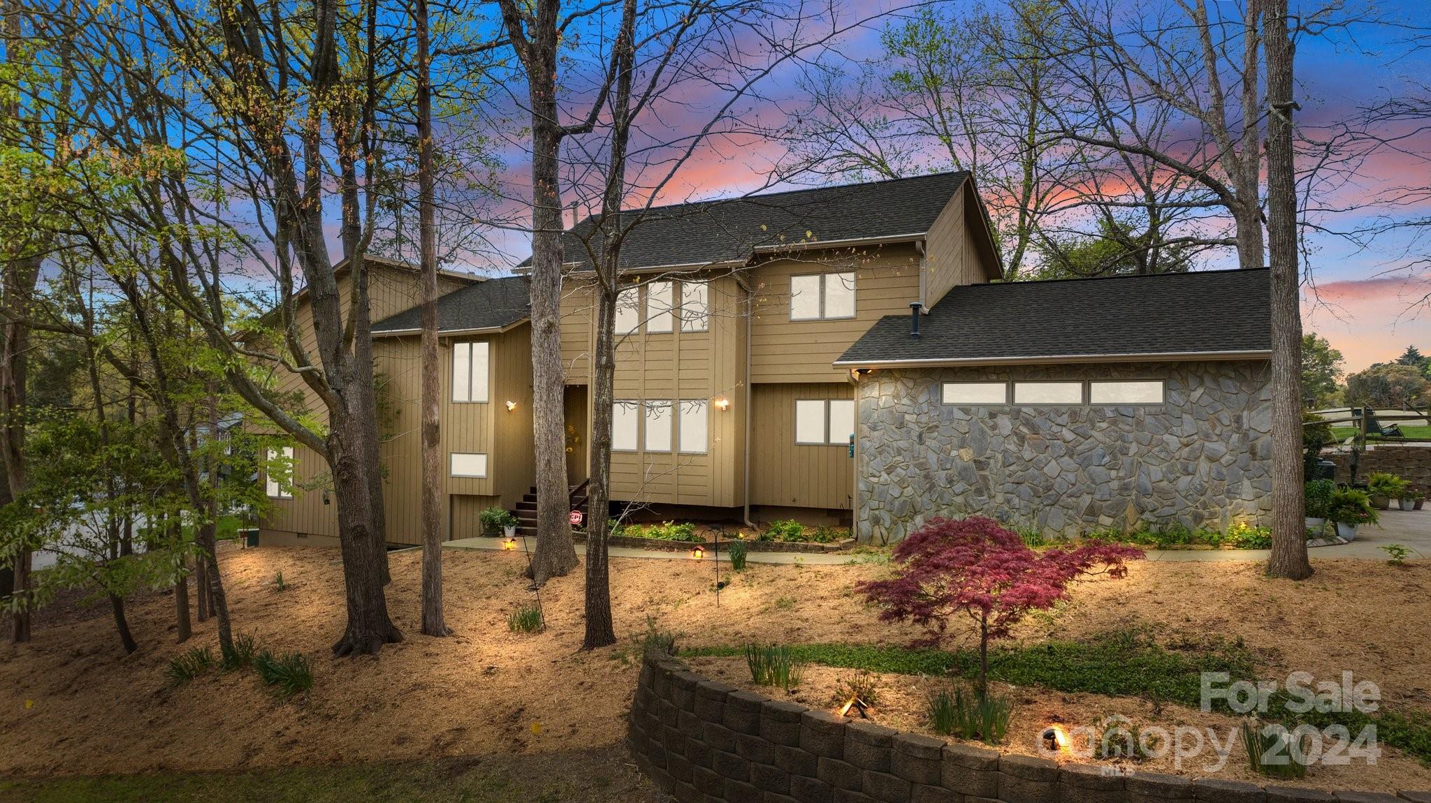 4500 Rounding Run Road Charlotte, NC 28277 - Photo 2 of 41 a front view of a house with a yard and garage