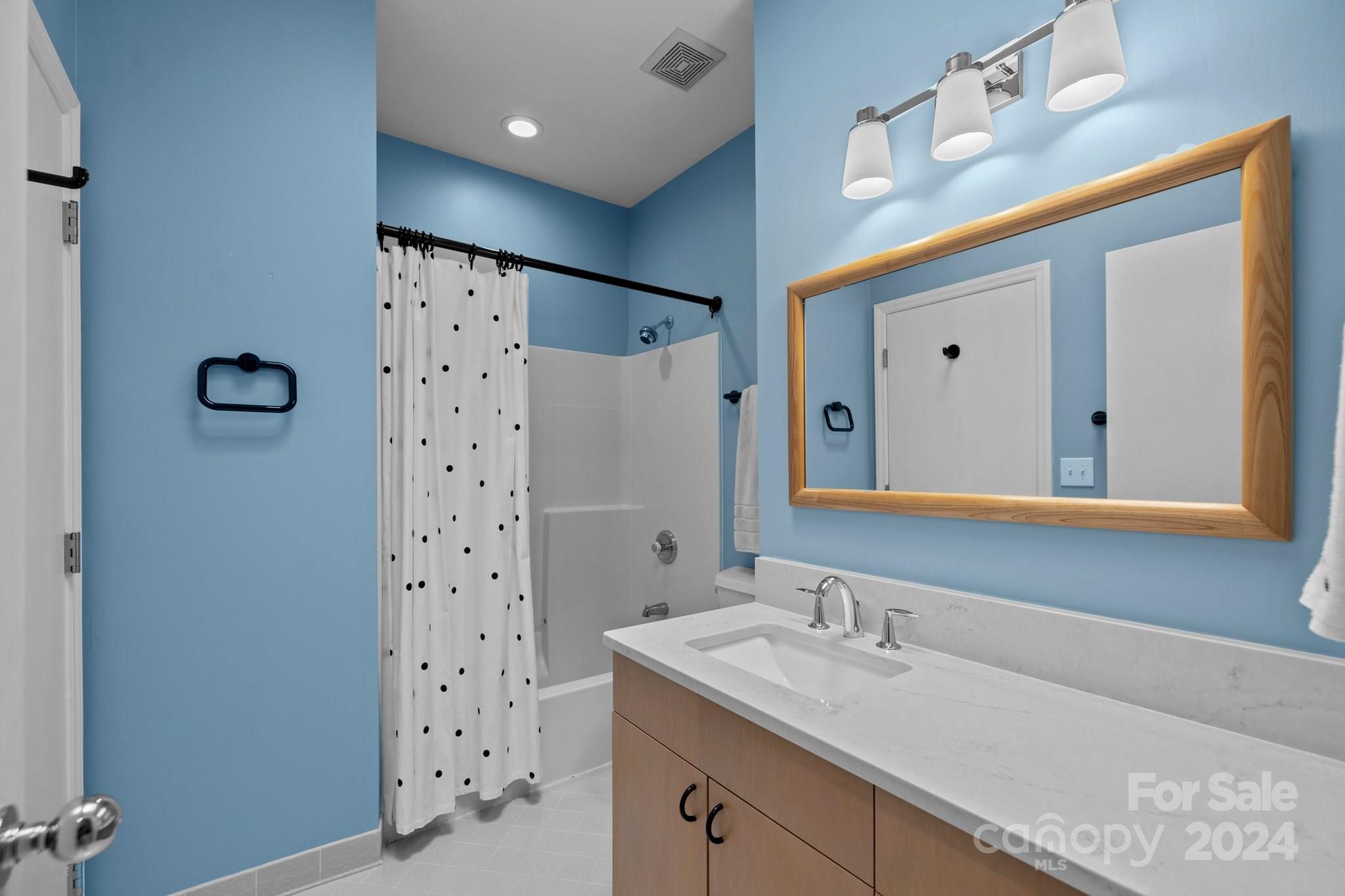 4500 Rounding Run Road Charlotte, NC 28277 - Photo 23 of 41 a bathroom with a sink a mirror and a shower