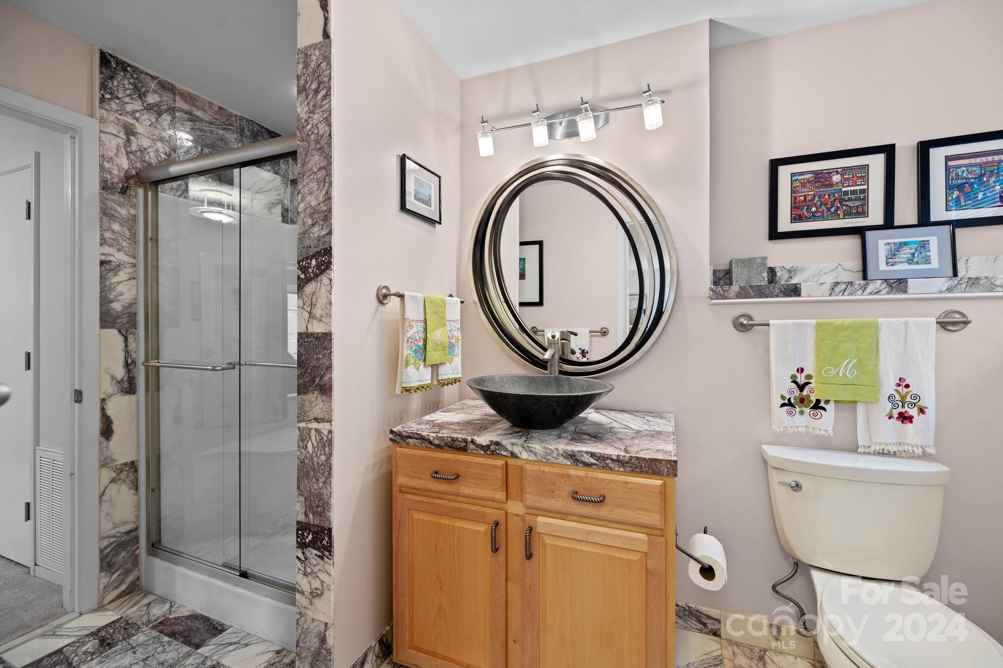 4500 Rounding Run Road Charlotte, NC 28277 - Photo 25 of 41 a bathroom with a toilet a sink and a shower