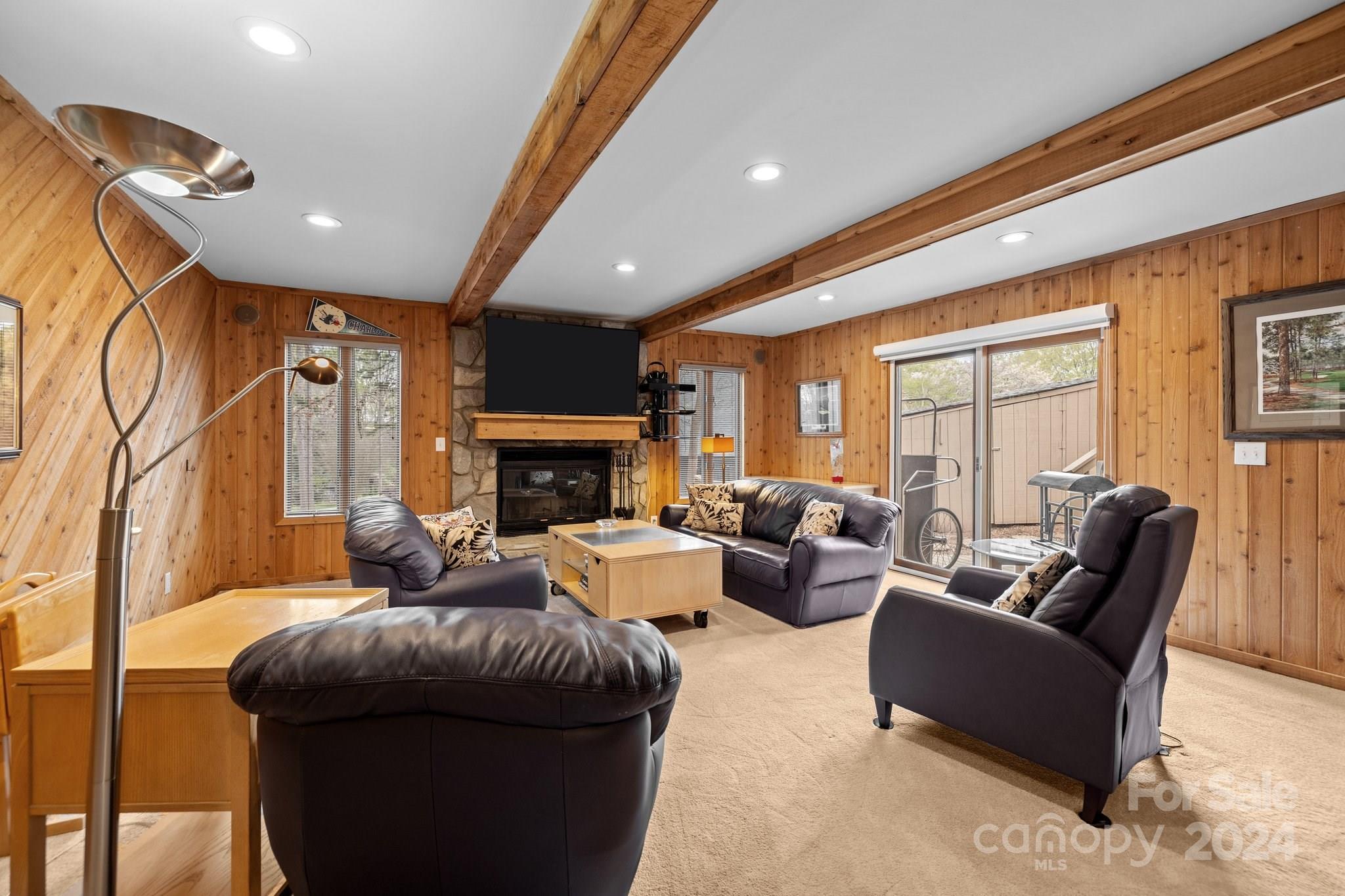 4500 Rounding Run Road Charlotte, NC 28277 - Photo 27 of 41 a living room with furniture a fireplace and a large window