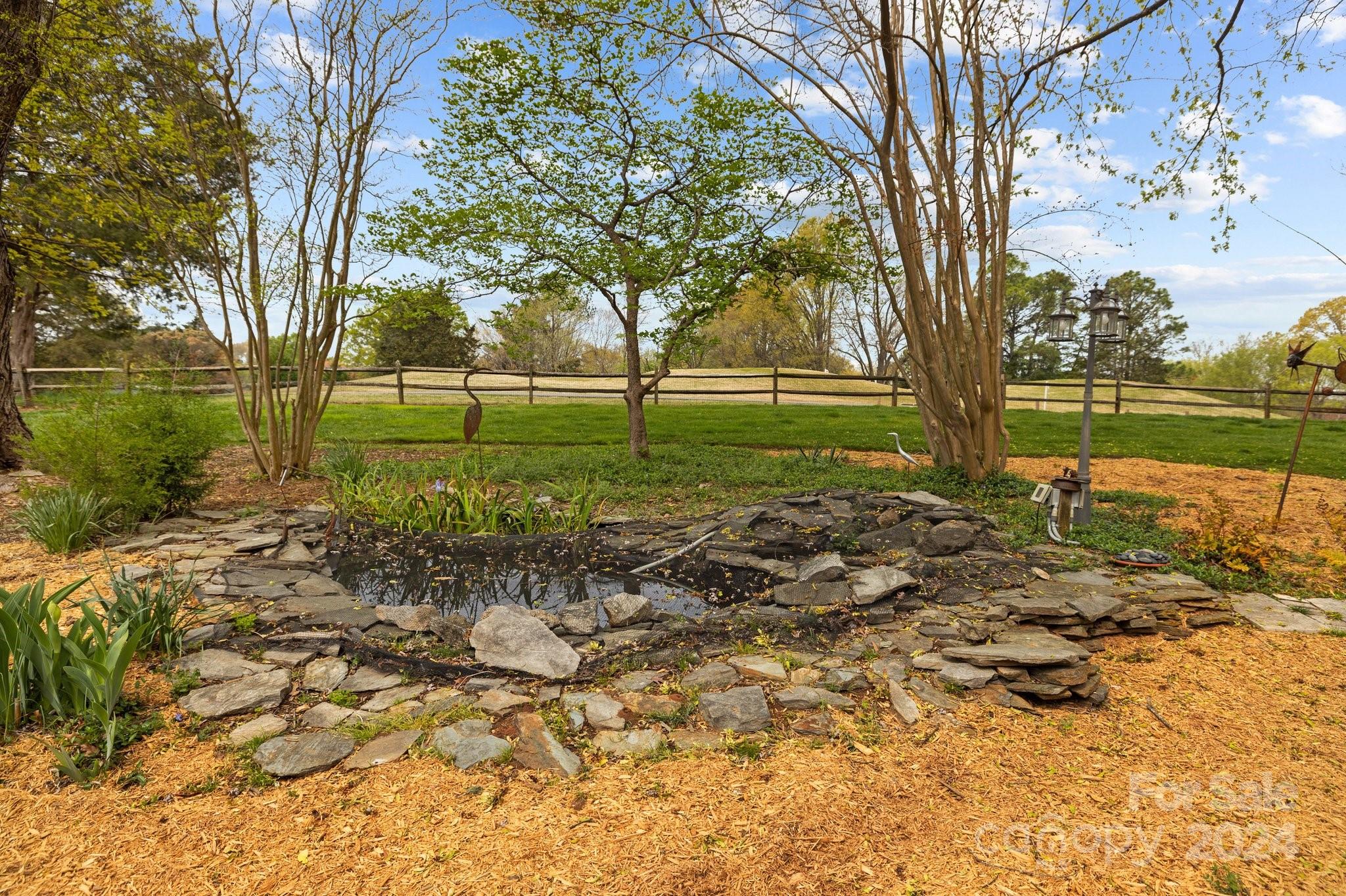 4500 Rounding Run Road Charlotte, NC 28277 - Photo 35 of 41 a view of a garden with large trees