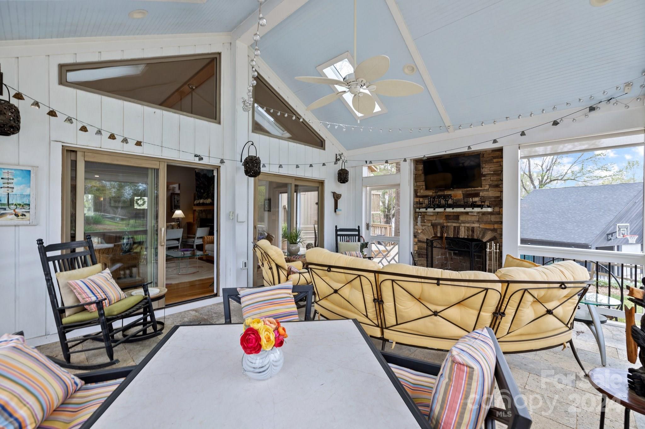 4500 Rounding Run Road Charlotte, NC 28277 - Photo 6 of 41 a living room with furniture a flat screen tv and a floor to ceiling window