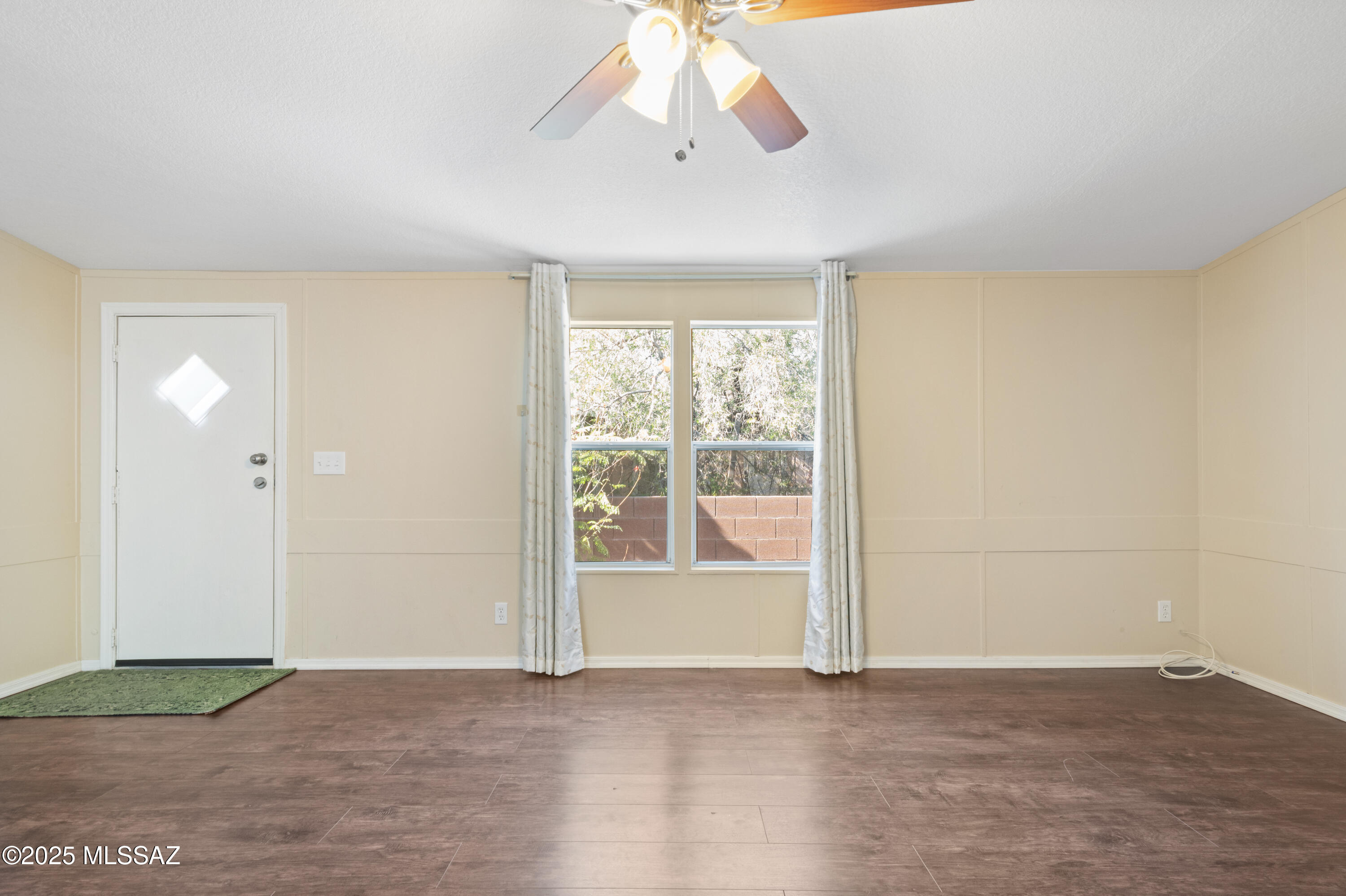 6205 East Rough Rock Drive Tucson, AZ 85756 - Photo 6 of 30 a view of an empty room with a window