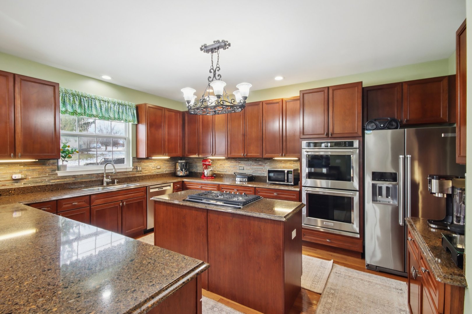 2930 Kelly Drive Elgin, IL 60124 - Photo 12 of 45 a kitchen with stainless steel appliances granite countertop a sink stove and refrigerator