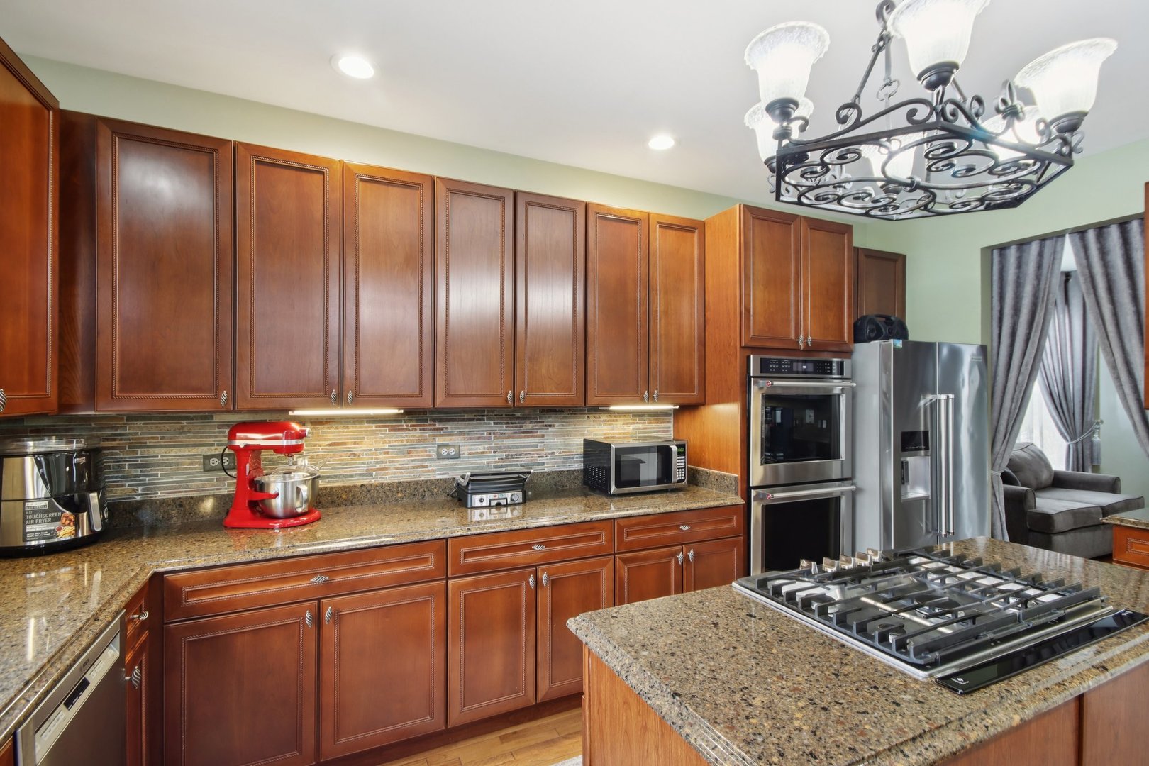 2930 Kelly Drive Elgin, IL 60124 - Photo 14 of 45 a kitchen with stainless steel appliances granite countertop a sink stove and refrigerator