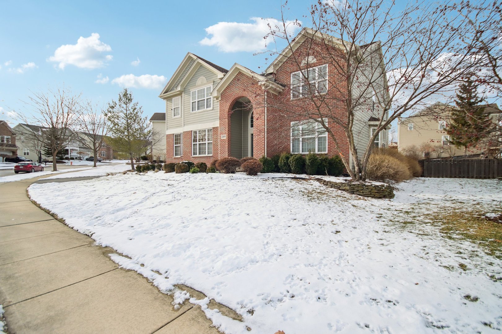 2930 Kelly Drive Elgin, IL 60124 - Photo 2 of 45 a front view of a house with a yard covered in snow