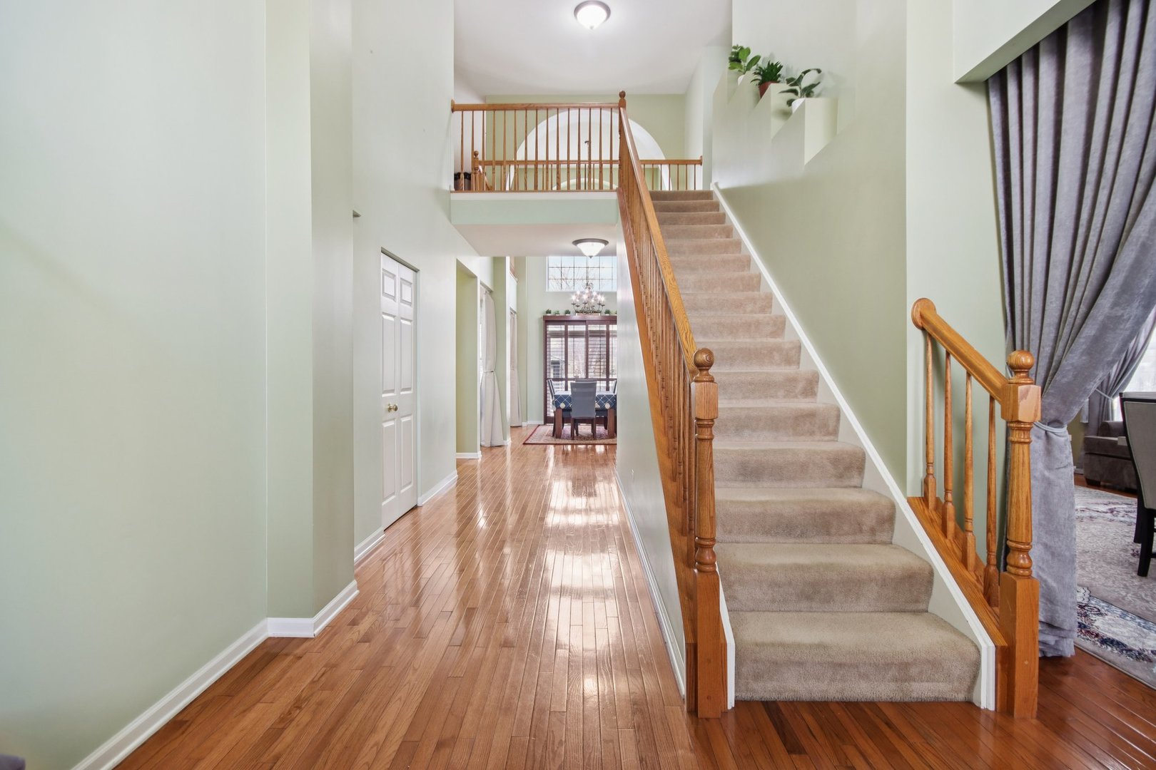 2930 Kelly Drive Elgin, IL 60124 - Photo 5 of 45 a view of a hallway with wooden floor and staircase