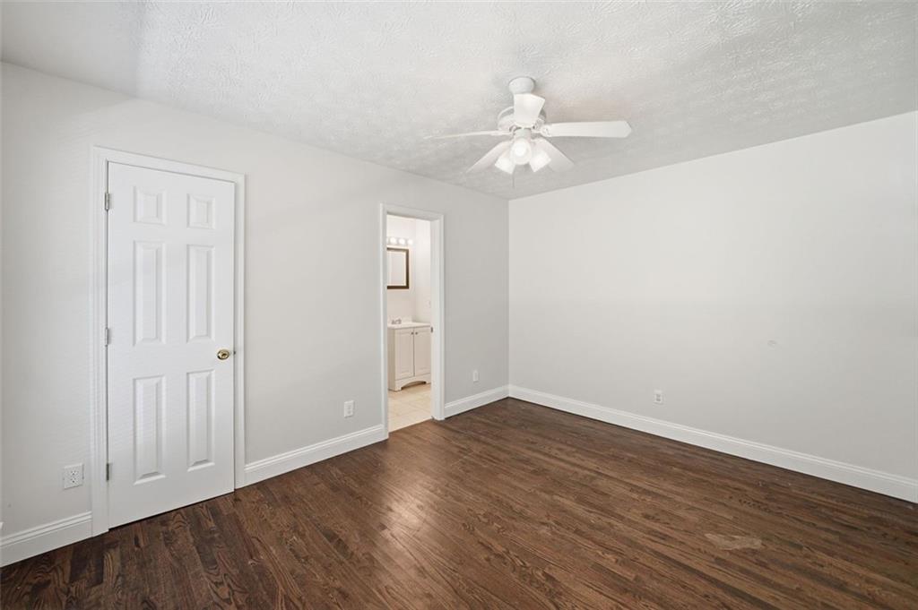 1512 Upper Sassafras Road Jasper, GA 30143 - Photo 27 of 41 a view of an empty room with wooden floor