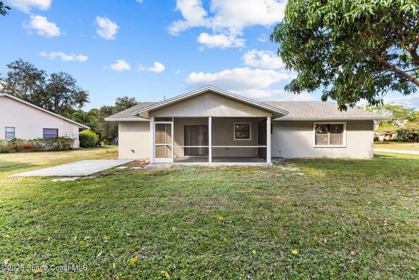 402 Southwest Sansom Lane Port St. Lucie, FL 34953 - Photo 24 of 33 a house view with a garden space