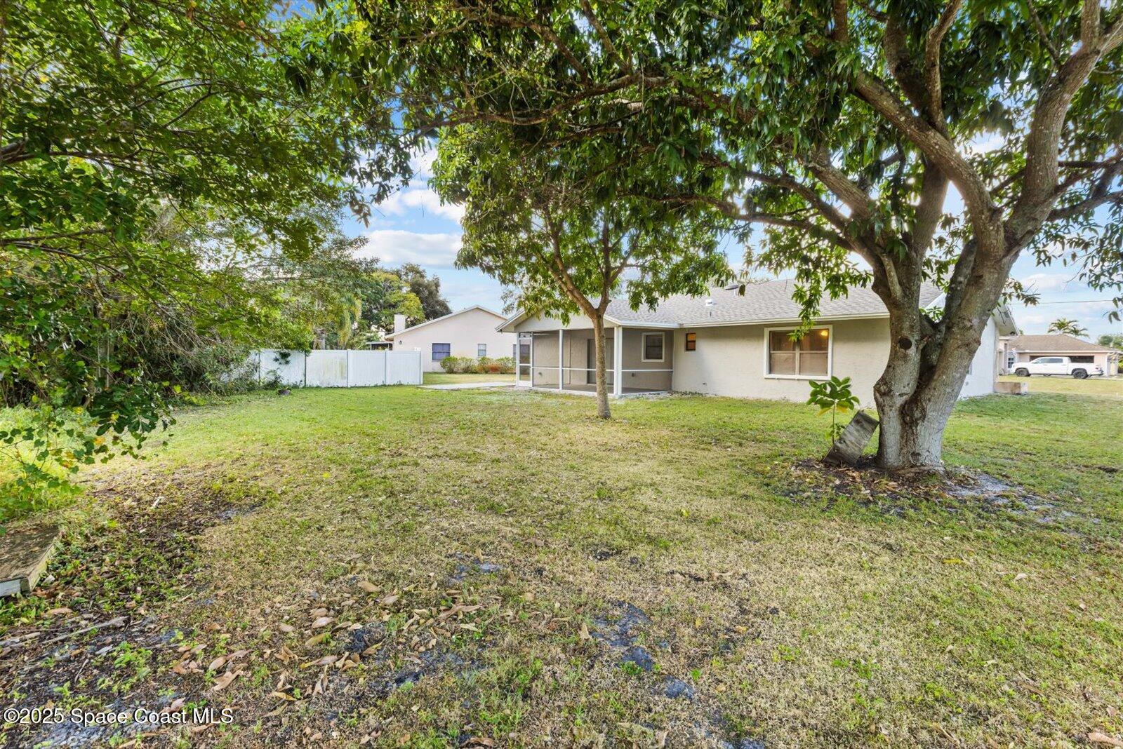402 Southwest Sansom Lane Port St. Lucie, FL 34953 - Photo 26 of 33 a house view with a garden space
