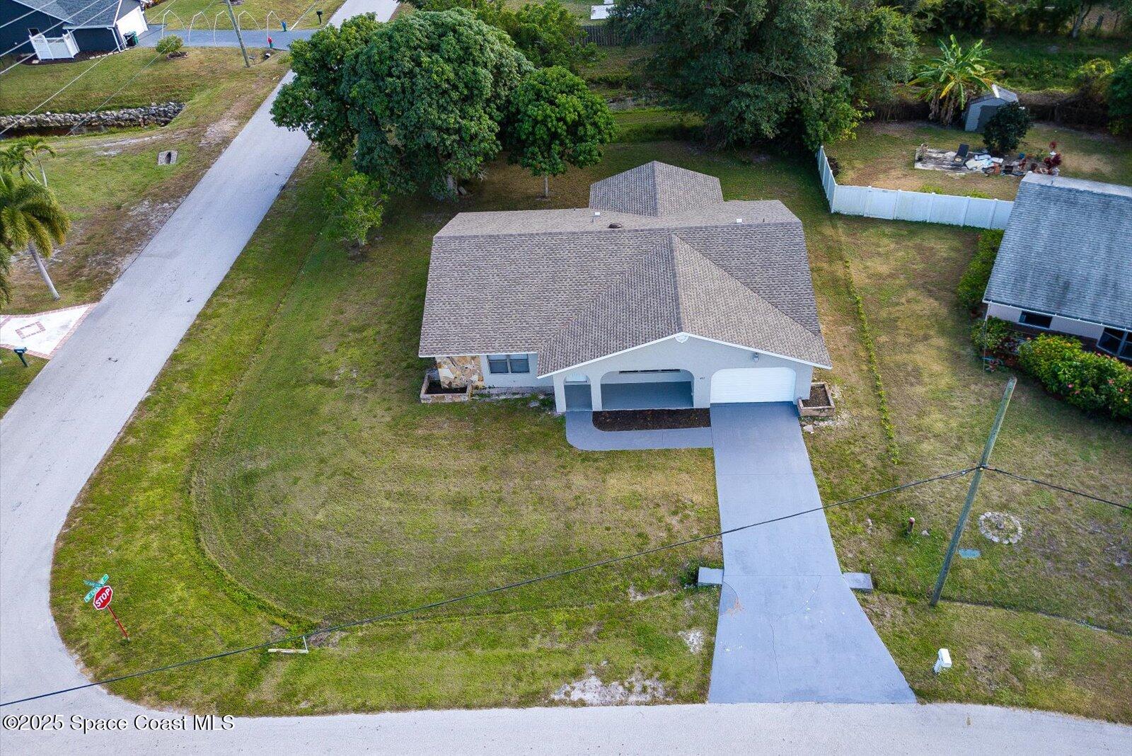 402 Southwest Sansom Lane Port St. Lucie, FL 34953 - Photo 27 of 33 a view of a swimming pool with a patio