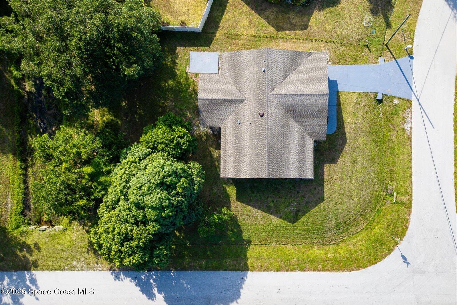 402 Southwest Sansom Lane Port St. Lucie, FL 34953 - Photo 28 of 33 a aerial view of a house with a garden and plants