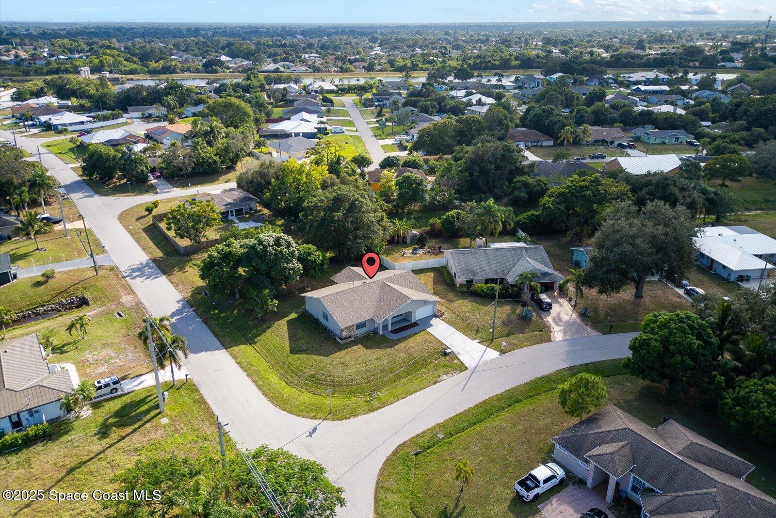 402 Southwest Sansom Lane Port St. Lucie, FL 34953 - Photo 29 of 33 an aerial view of residential houses with outdoor space