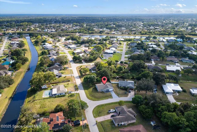 an aerial view of residential houses with outdoor space