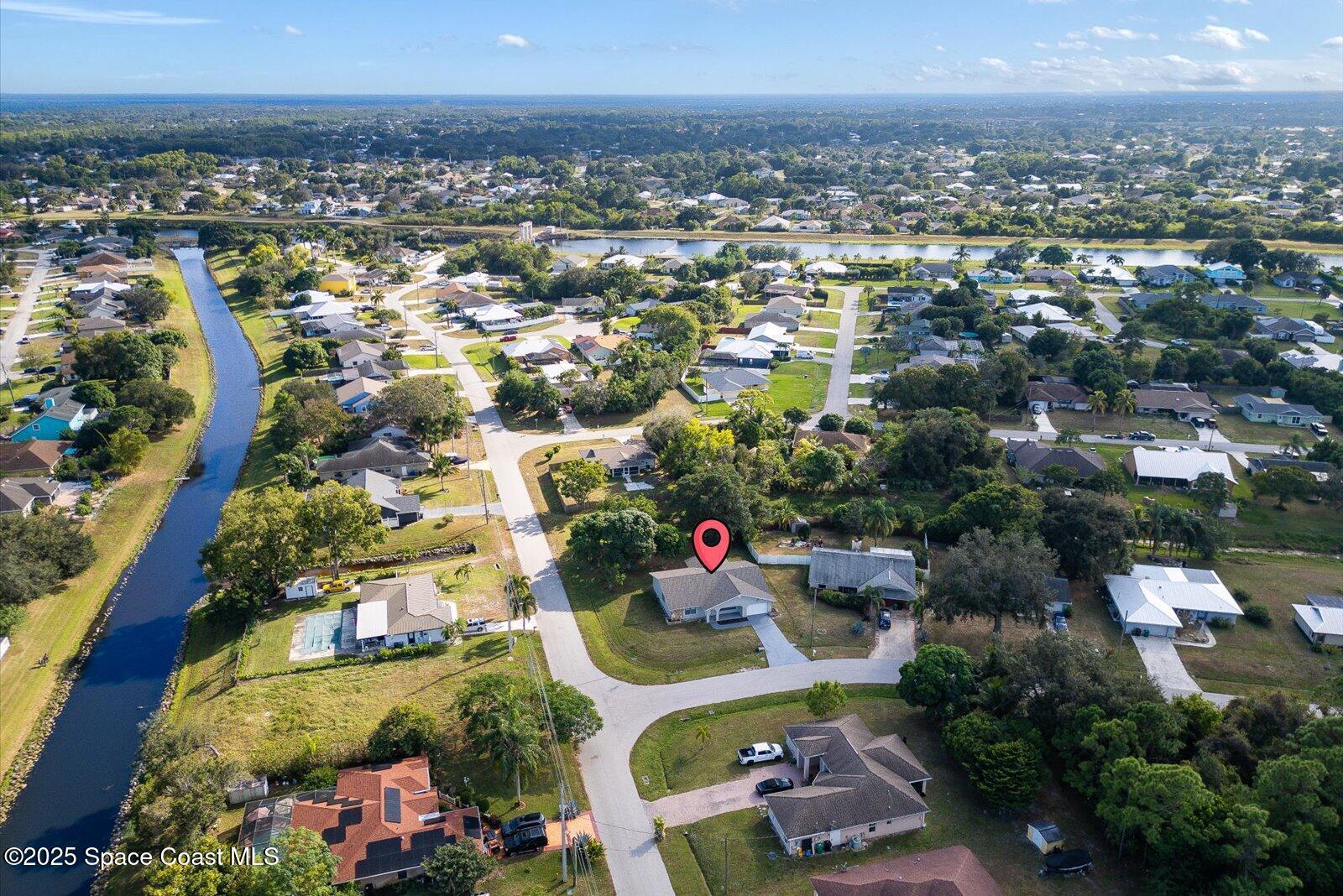 402 Southwest Sansom Lane Port St. Lucie, FL 34953 - Photo 30 of 33 an aerial view of residential houses with outdoor space