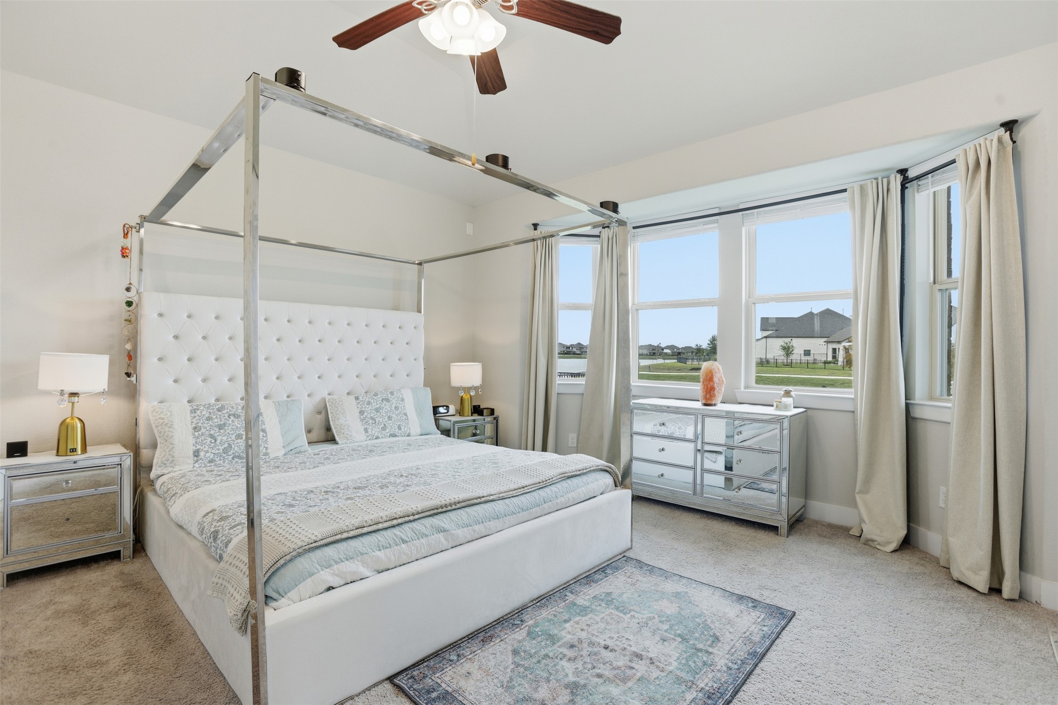 2725 Arbor Edge Crossing La Marque, TX 77568 - Photo 20 of 38 a bedroom with a large bed and a chandelier fan