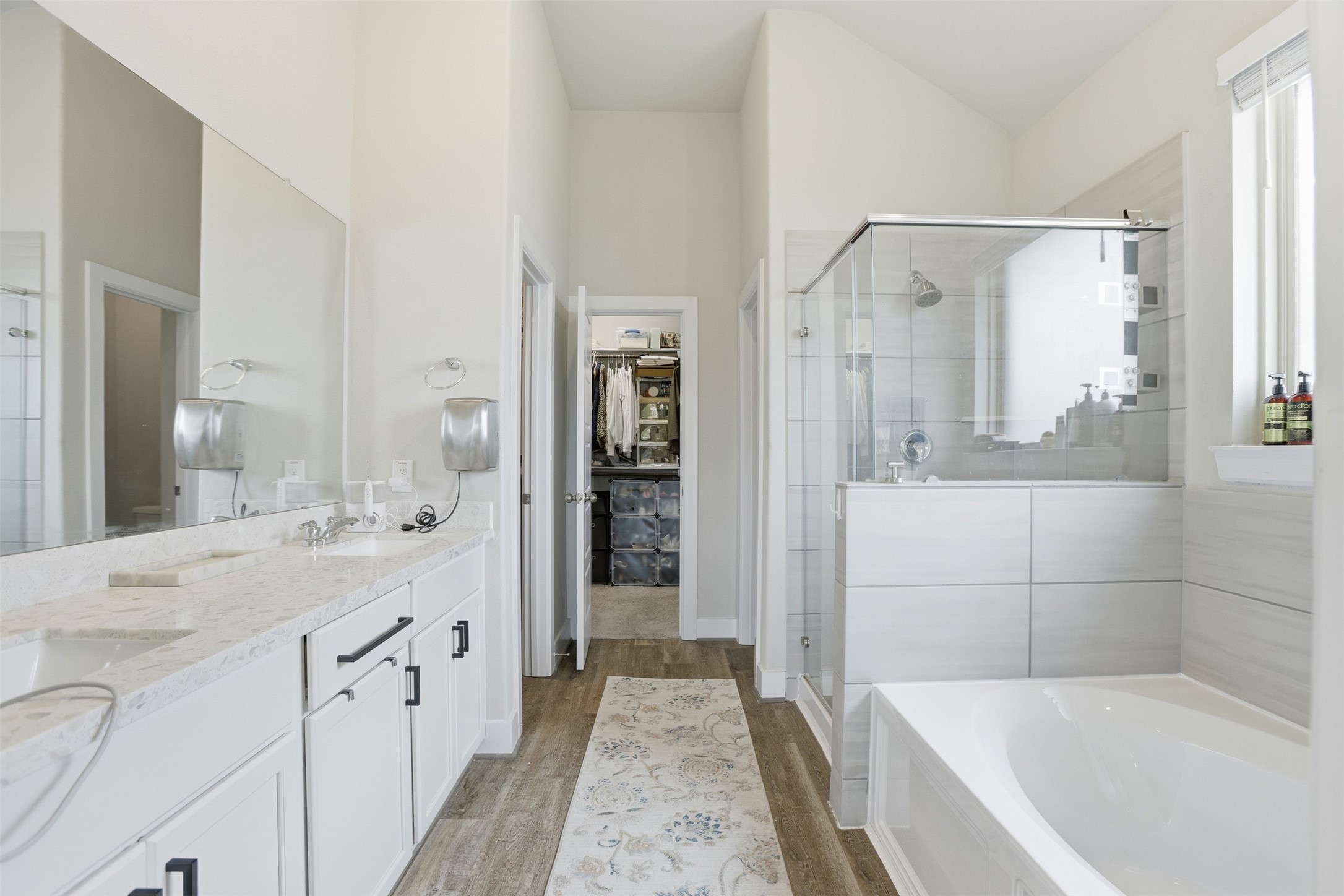 2725 Arbor Edge Crossing La Marque, TX 77568 - Photo 23 of 38 a bathroom with a tub sink shower and mirror