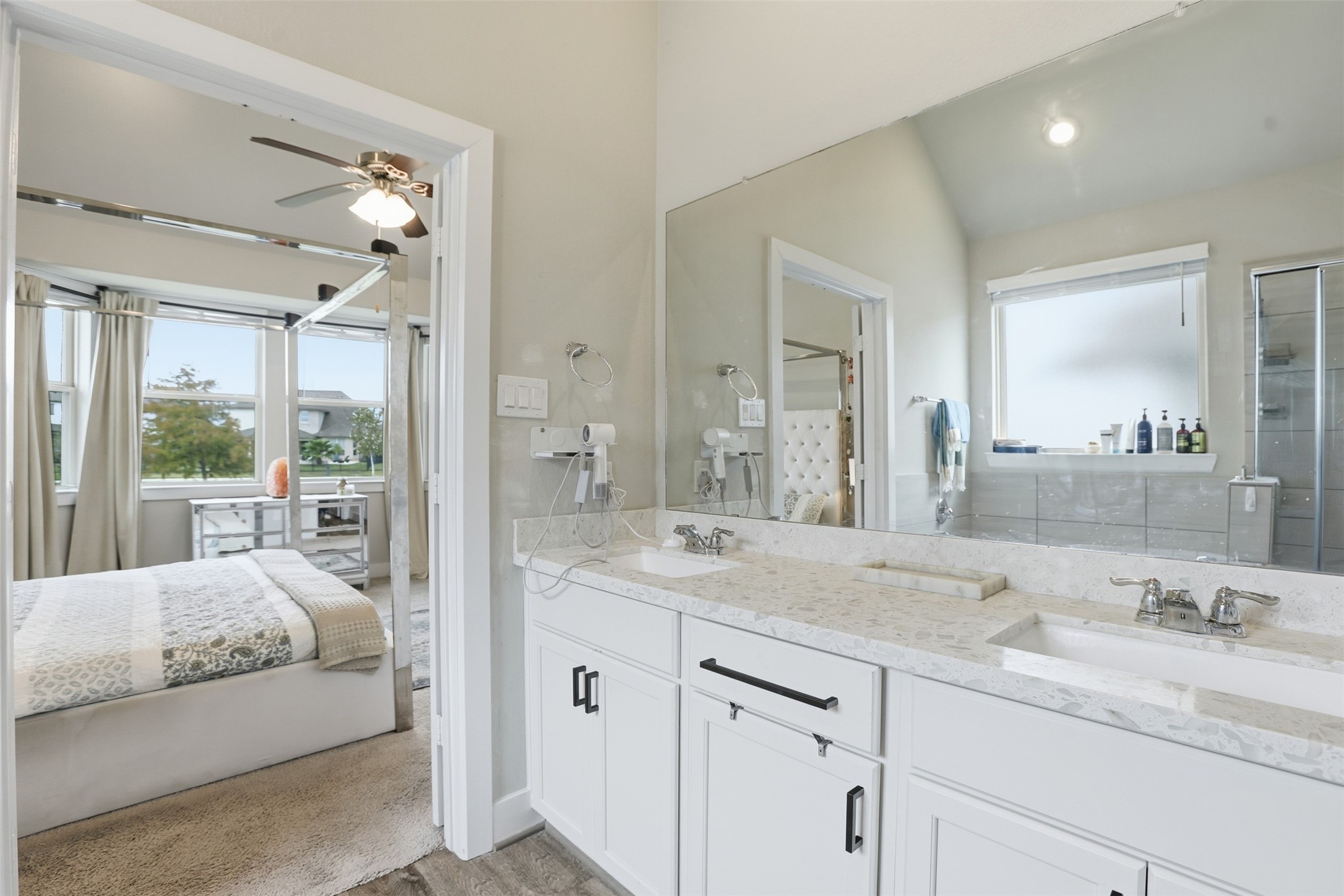 2725 Arbor Edge Crossing La Marque, TX 77568 - Photo 24 of 38 a en suite bathroom with a granite countertop double vanity sink a mirror and a shower