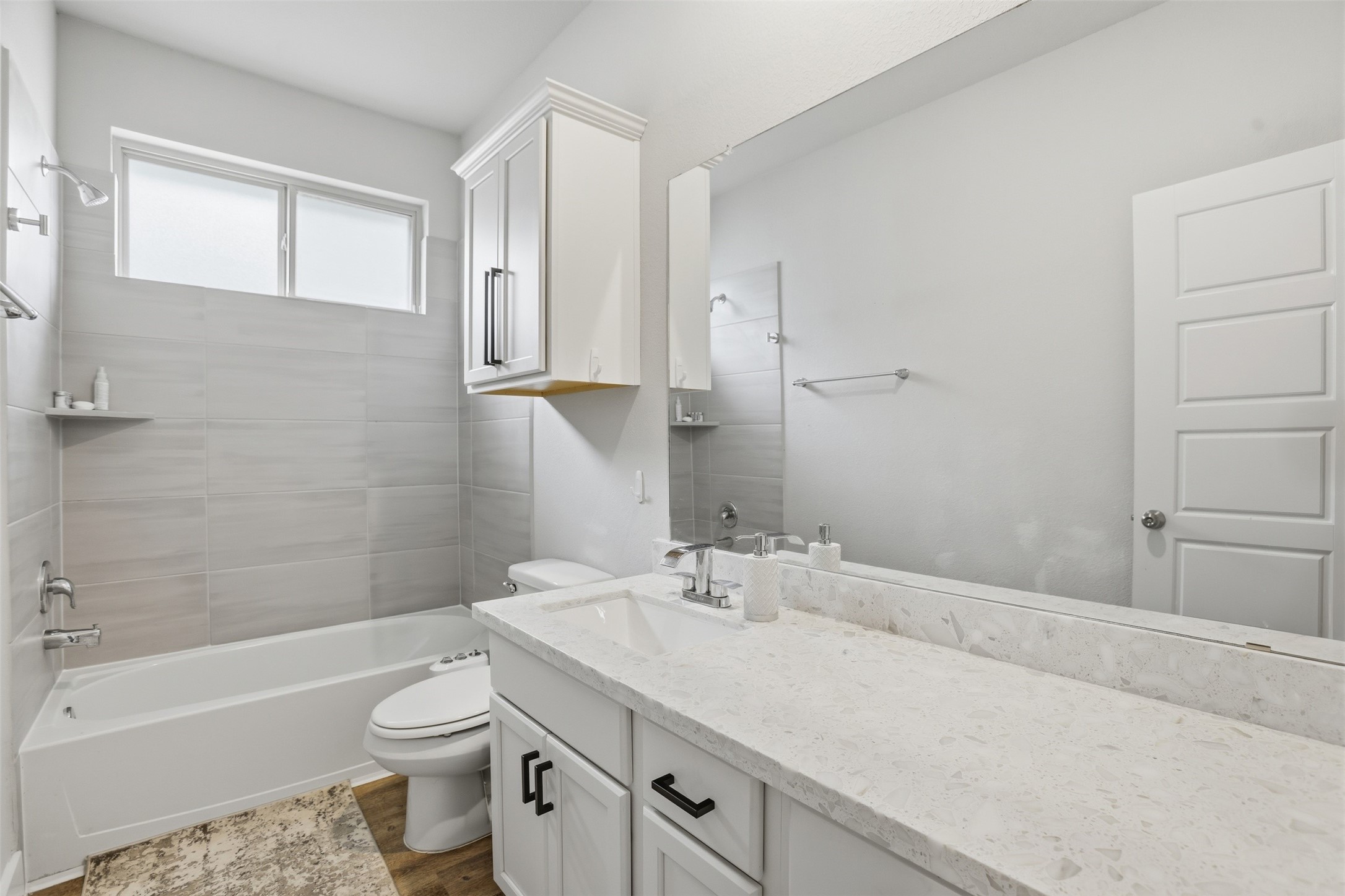 2725 Arbor Edge Crossing La Marque, TX 77568 - Photo 27 of 38 a bathroom with a sink toilet a vanity and bathtub