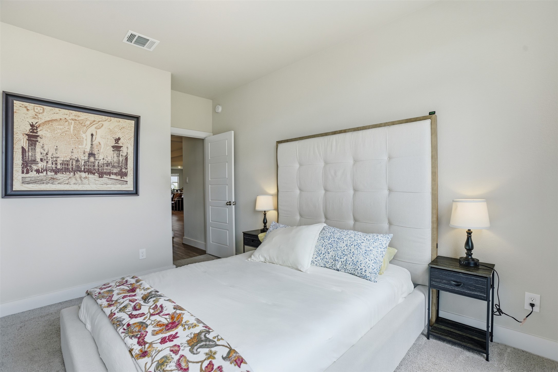 2725 Arbor Edge Crossing La Marque, TX 77568 - Photo 29 of 38 a bedroom with a bed and a lamp on dresser