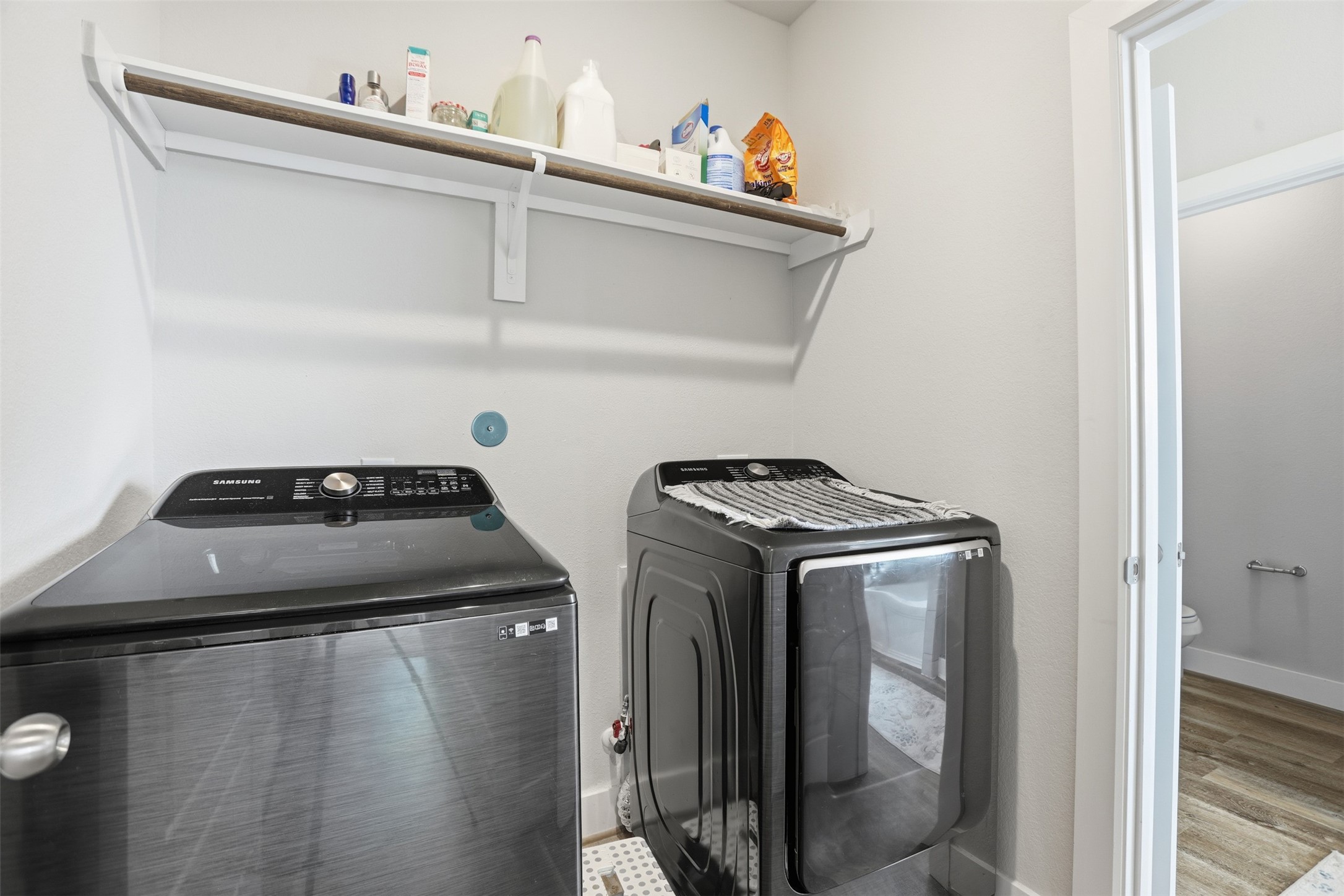 2725 Arbor Edge Crossing La Marque, TX 77568 - Photo 30 of 38 a close view of laundry room with washer and dryer