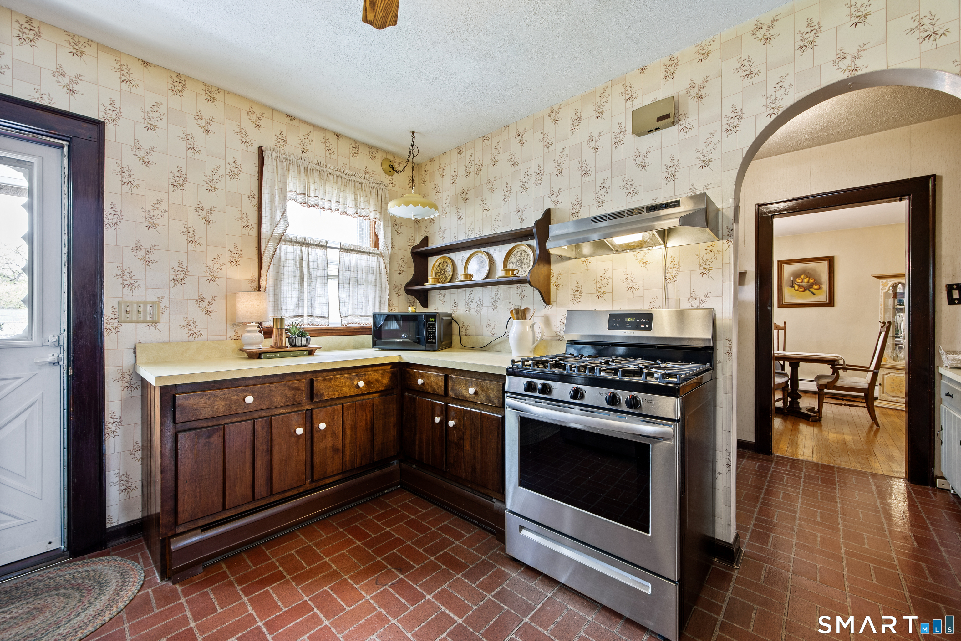 90 Harvard Avenue Meriden, CT 06451 - Photo 11 of 39 a kitchen with stainless steel appliances granite countertop a stove and a sink