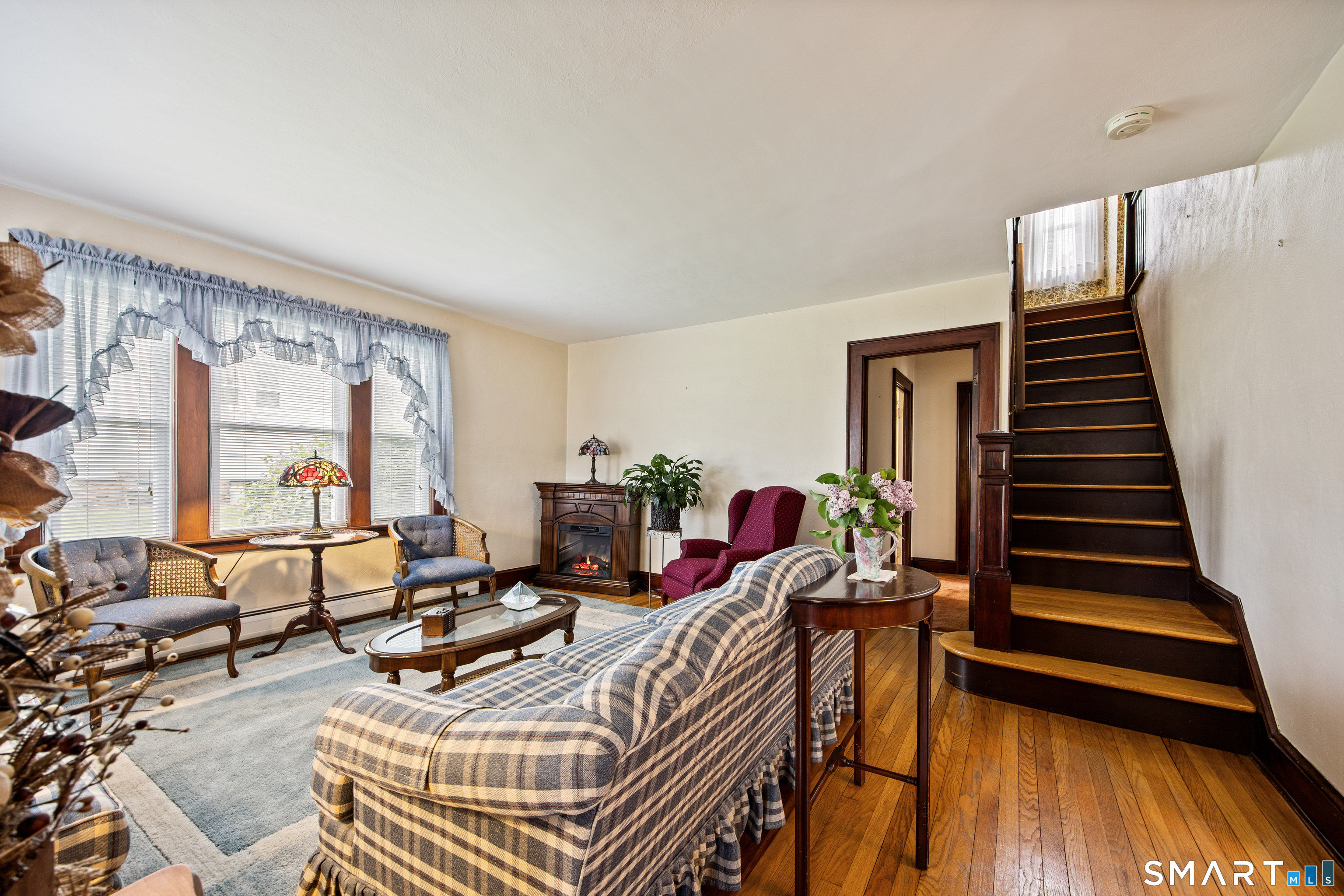 90 Harvard Avenue Meriden, CT 06451 - Photo 21 of 39 a view of a livingroom with furniture and a floor to ceiling window