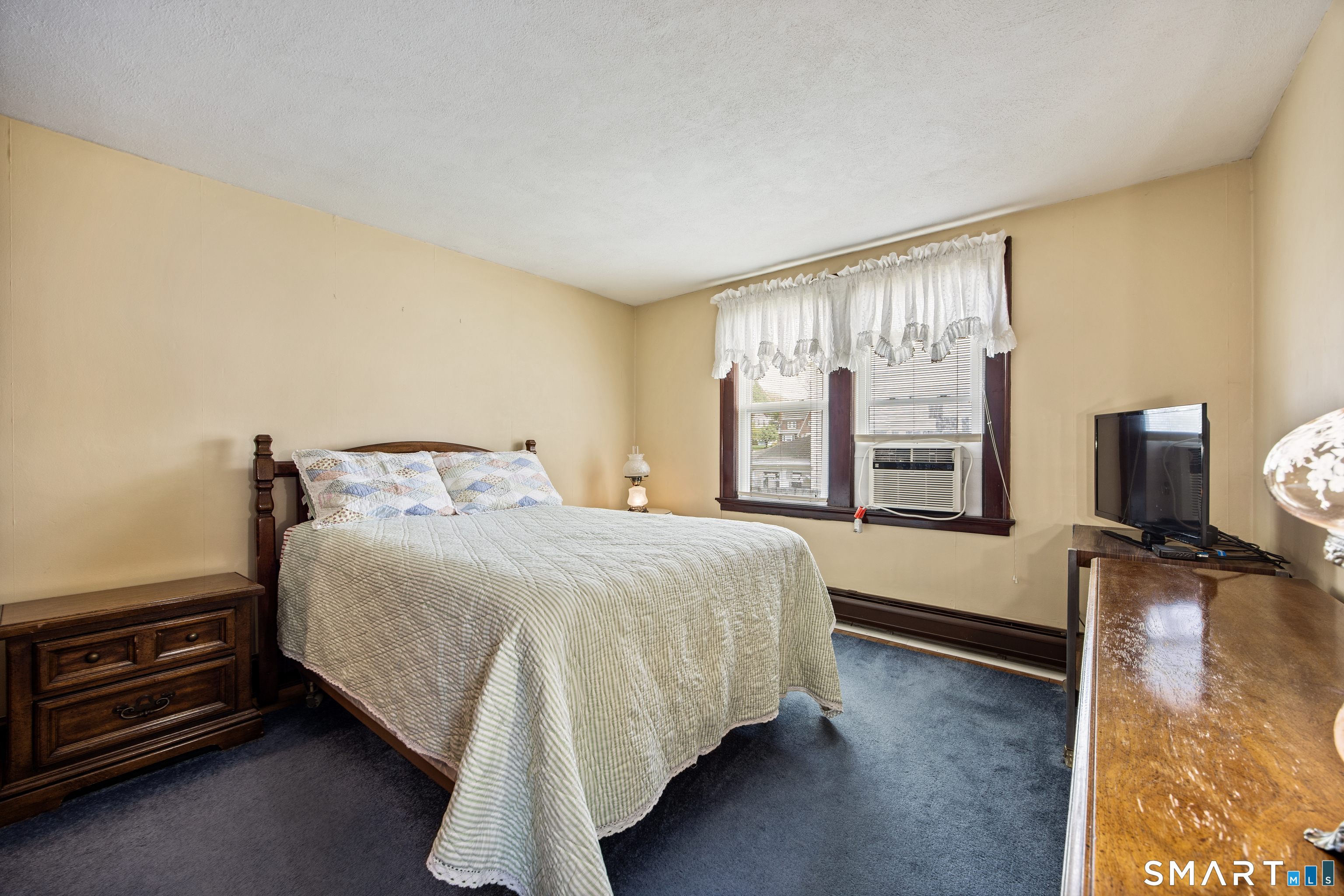 90 Harvard Avenue Meriden, CT 06451 - Photo 29 of 39 a bedroom with a bed and large window