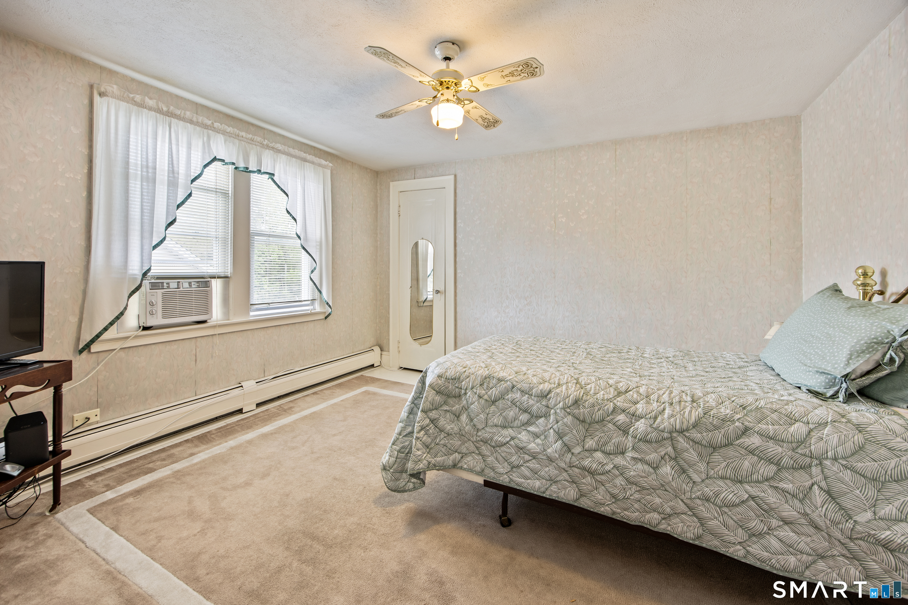 90 Harvard Avenue Meriden, CT 06451 - Photo 35 of 39 a bedroom with a bed and a large window with outer view