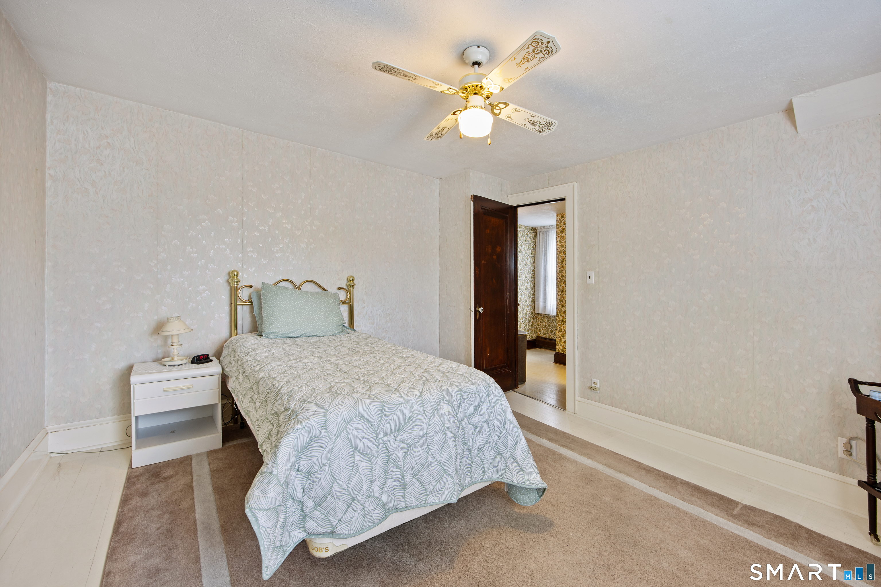 90 Harvard Avenue Meriden, CT 06451 - Photo 36 of 39 a bedroom with a bed and a chandelier
