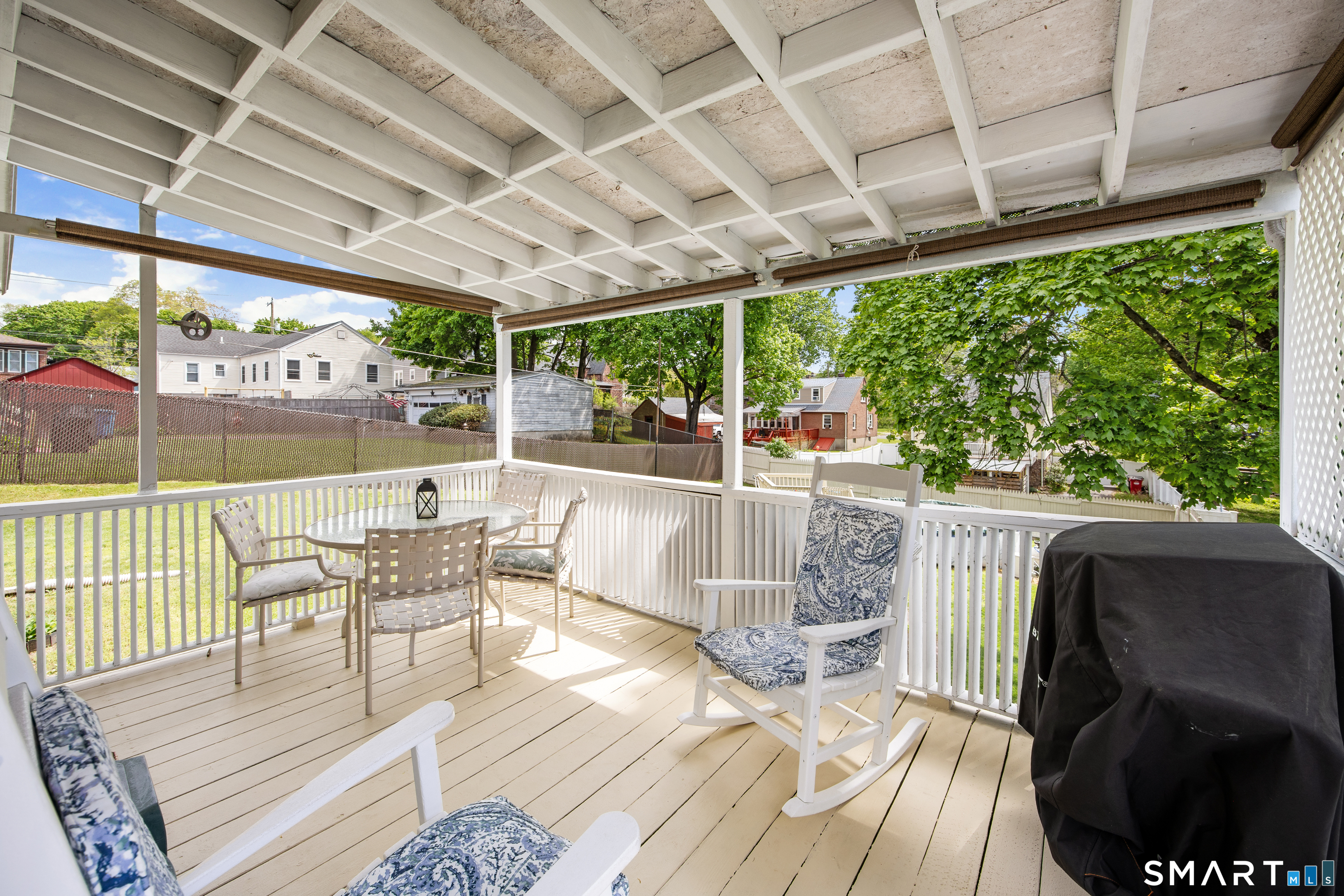 90 Harvard Avenue Meriden, CT 06451 - Photo 4 of 39 a view of a patio with chairs and wooden floor