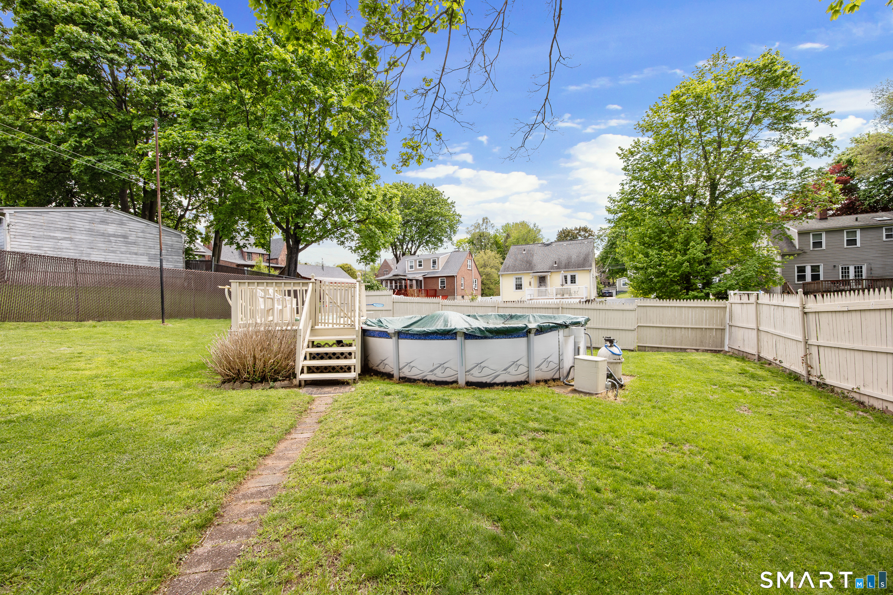 90 Harvard Avenue Meriden, CT 06451 - Photo 7 of 39 a view of a house with backyard and sitting area