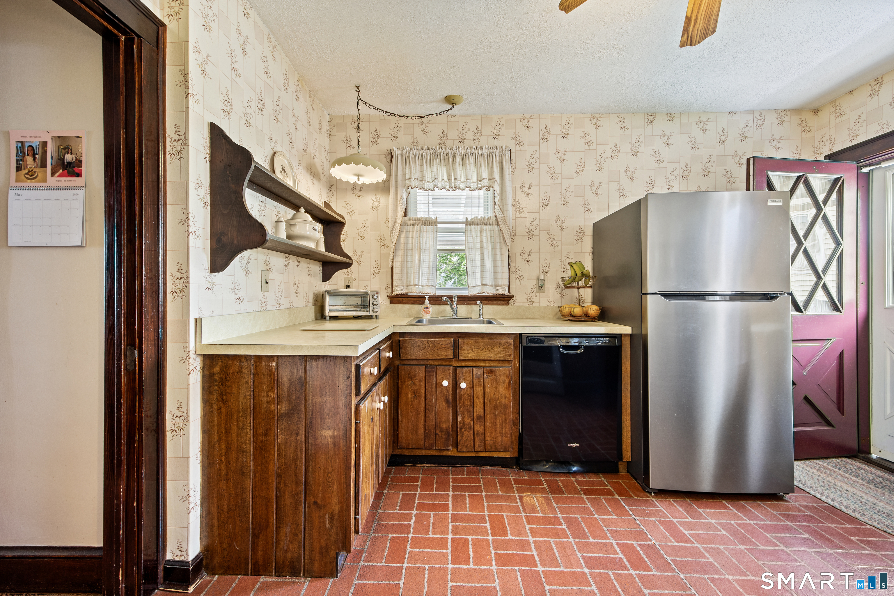 90 Harvard Avenue Meriden, CT 06451 - Photo 10 of 39 a kitchen with a refrigerator a sink and dishwasher