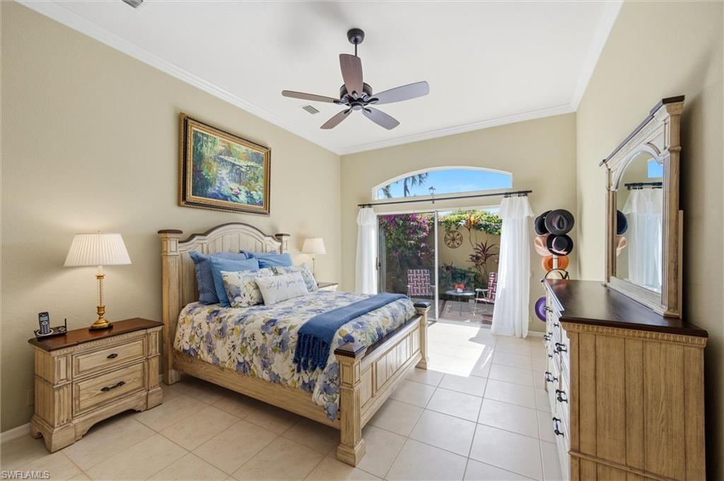 3033 Olde Cove Way Naples, FL 34119 - Photo 25 of 49 Primary bedroom with private lanai area