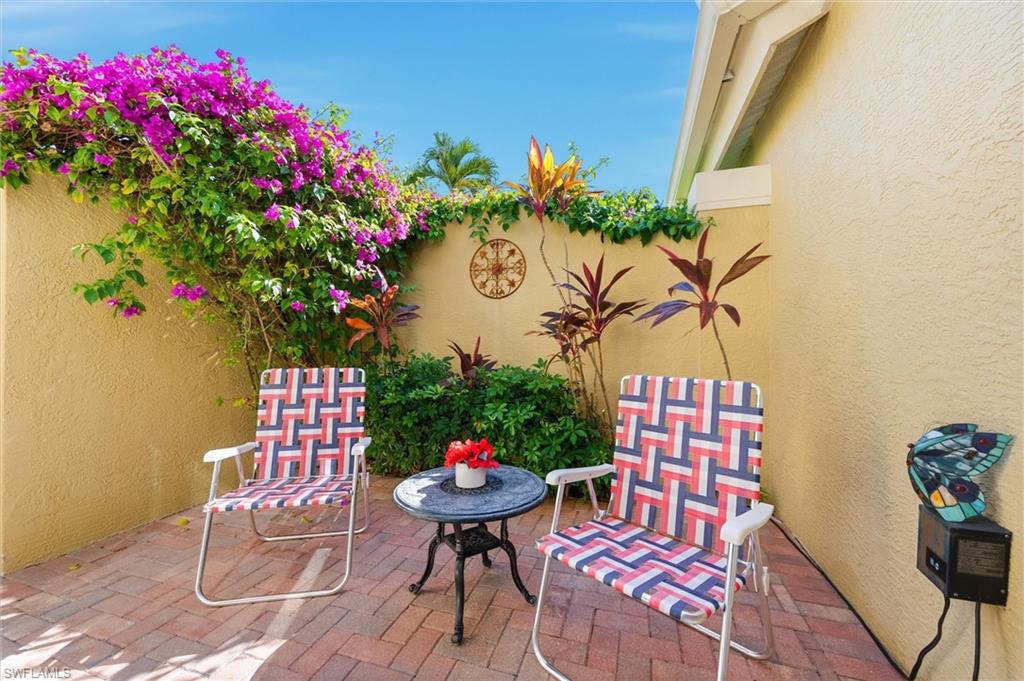 3033 Olde Cove Way Naples, FL 34119 - Photo 27 of 49 View of private patio off primary bedroom