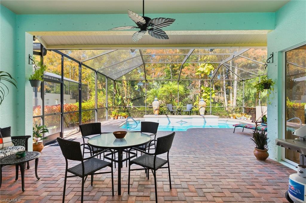3033 Olde Cove Way Naples, FL 34119 - Photo 39 of 49 View of patio in lanai and pool