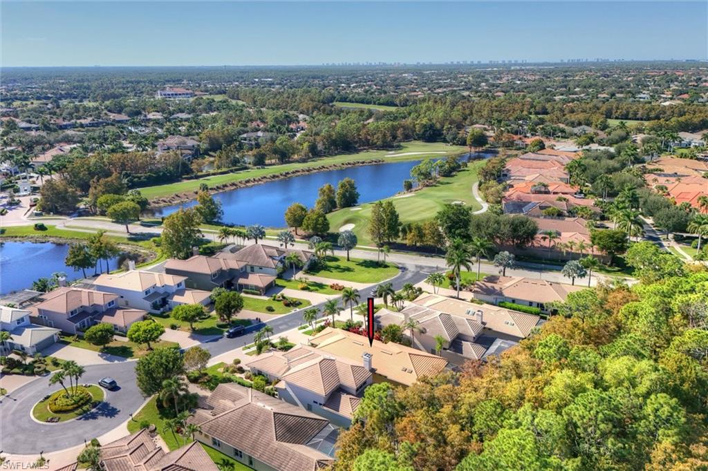 3033 Olde Cove Way Naples, FL 34119 - Photo 5 of 49 Aerial perspective of cul-de-sac featuring nearby ponds and golf course