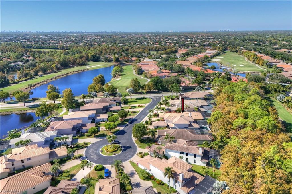 3033 Olde Cove Way Naples, FL 34119 - Photo 6 of 49 Aerial perspective of cul-de-sac featuring nearby ponds and golf course
