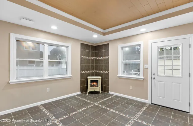 a view of an empty room with a window