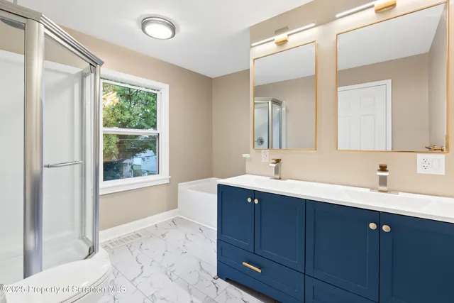 a view of a white house with a big yard and large trees